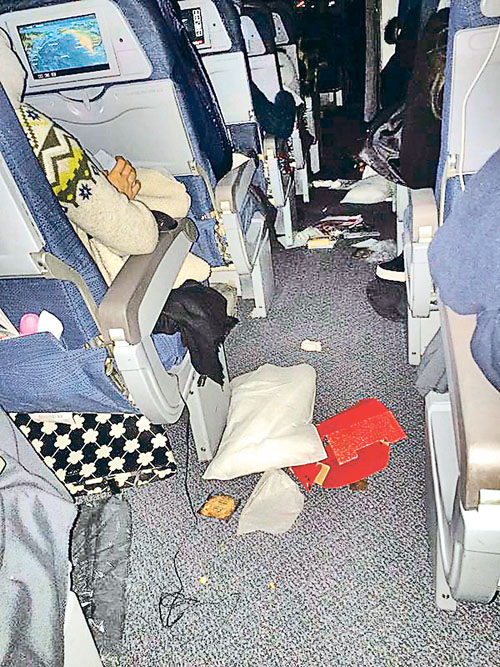 The cabin of Air Canada Flight 088 is shown in this image provided by passenger Helen Zhang to members of the media. Passengers are describing a Toronto-bound Air Canada flight that was diverted to Calgary on Wednesday as a terrifying roller-coaster ride. THE CANADIAN PRESS/HO-Helen Zhang