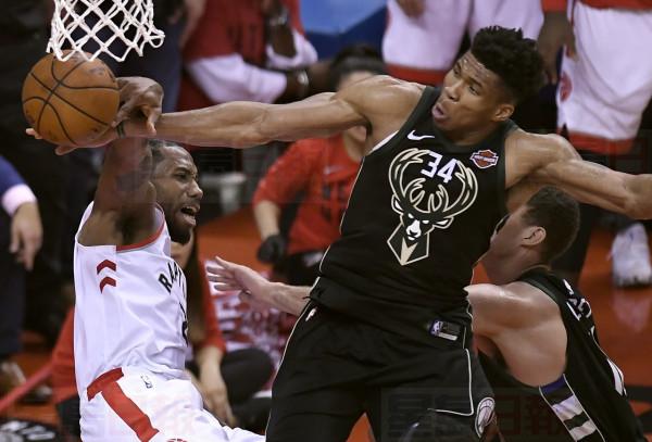 Milwaukee Bucks forward Giannis Antetokounmpo (34) blocks a dunk attempt by Toronto Raptors forward Kawhi Leonard (2) during second half NBA Eastern Conference finals action in Toronto on Saturday, May 25, 2019. THE CANADIAN PRESS/Frank Gunn