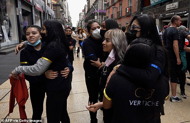 Women comfort each other after an earthquake in Mexico City on September 19, 2022