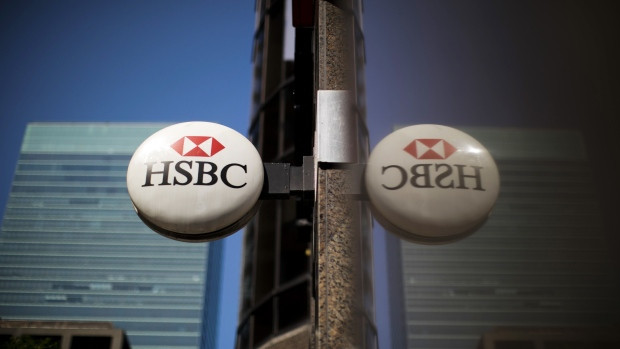 HSBC Holdings Plc signage hangs outside a bank branch in the financial district of Toronto, Ontario, Canada, on Thursday, July 25, 2019. Canadian stocks fell as tech heavyweight Shopify Inc. weighed on the benchmark and investors continued to flee pot companies.